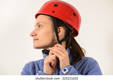 Woman putting on her helmet on white background - Powered by Shutterstock