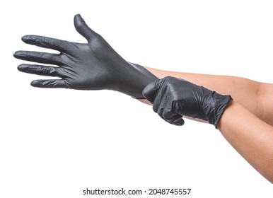 Woman putting on protective gloves on white background - Shutterstock ID 2048745557