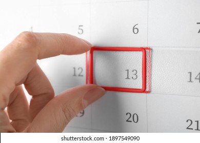 Woman Putting Reminder On Friday 13, Closeup. Bad Luck Superstition