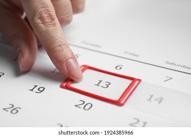 Woman Putting Reminder On Friday 13, Closeup. Bad Luck Superstition