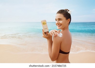 Woman Putting Sunblock Lotion On Shoulder Before Tanning During Summer Holiday On Beach Vacation Resort 