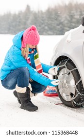 Woman Putting Winter Tire Chains On Car Wheel Snow Breakdown