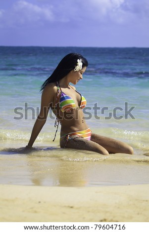 woman in rainbow bikini at a hawaii beach