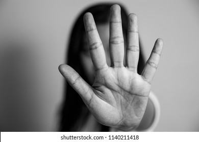woman raised her hand for dissuade, campaign stop violence against women. Asian woman raised her hand for dissuade with copy space, black and white color