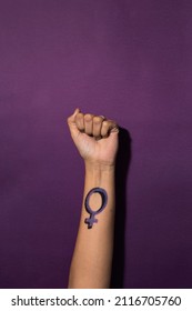 Woman Raises Her Fist With A Feminist Symbol On Her Forearm, Fights For Gender Equality, Feminism, Female Power