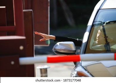 A woman reaching out and taking a parking ticket