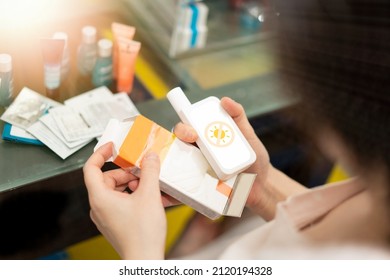 Woman Read Expire Date On Sunscreen Packaging