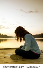 Woman Reading Bible At Sunrise