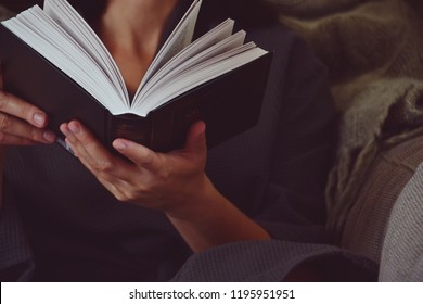 Woman Reading Book. Hygge Style Home Interior. Selected Focus