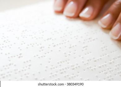 Woman reading braille