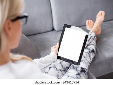 Woman reading ebook on tablet computer