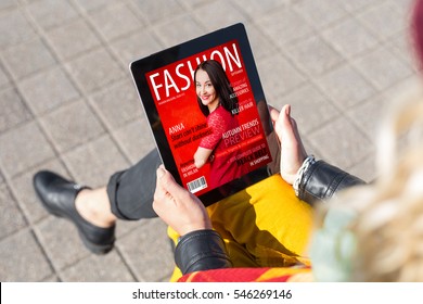Woman Reading Fashion Magazine On Tablet