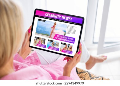 Woman reading gossip news about celebrities, fashion and entertainment