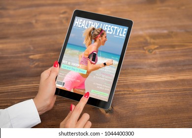 Woman Reading Healthy Lifestyle Magazine On Tablet