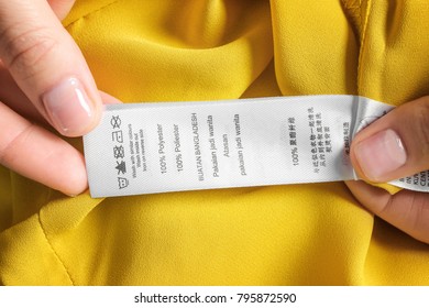 Woman Reading Instruction On Clothing Label Stock Photo 795872590 ...