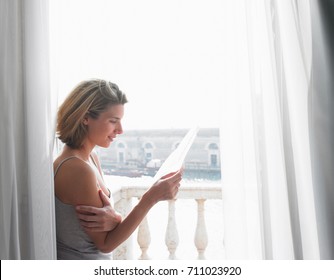 Woman Reading A Letter