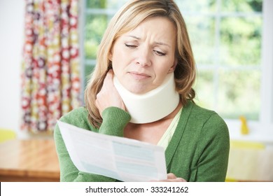 Woman Reading Letter After Receiving Neck Injury