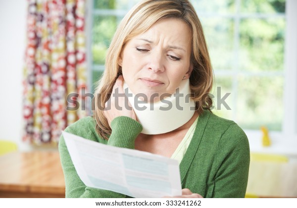 Woman Reading\
Letter After Receiving Neck\
Injury