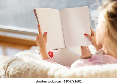Woman Reading Magazine With Empty White Blank Pages. Mockup And Template For Your Own Content.