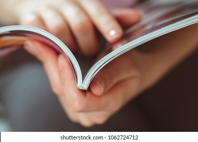 Woman Reading Magazine At Home