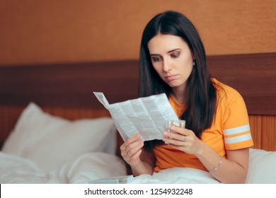 Woman Reading Medicine Leaflet Before Taking Pills. Careful Pregnant Girl Checking Medication Instructions For Safe Use
