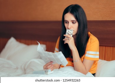 Woman Reading Medicine Leaflet Before Taking Pills. Careful Pregnant Girl Checking Medication Instructions For Safe Use
