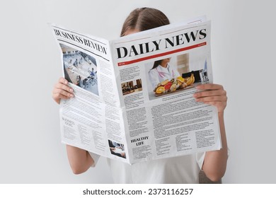 Woman reading morning newspaper on white background - Powered by Shutterstock