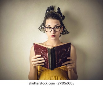 Woman Reading An Old Book