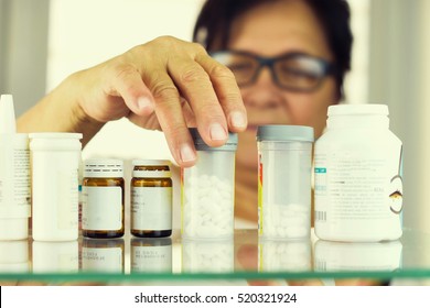 Woman Reading Prescription Bottle