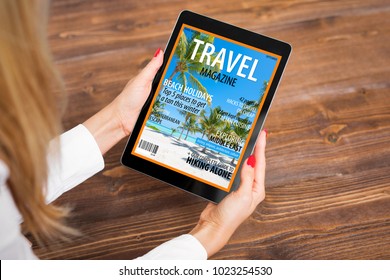 Woman Reading Travel Magazine On Tablet