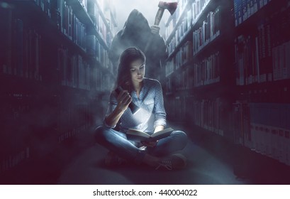 Woman Reads A Book In Dark Library