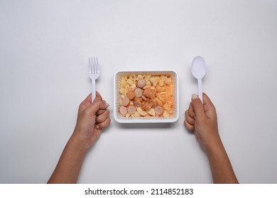 Woman Ready Eat Frozen Macaroni Pasta With Cheese Sauce.