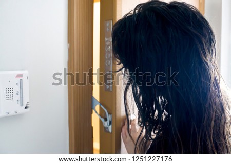Woman Ready Looking Through Door Gap Stock Photo Edit Now