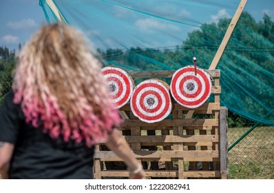 A Woman Is Ready For Throwing Axe On Competition.