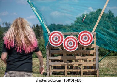 A Woman Is Ready For Throwing Axe On Competition.