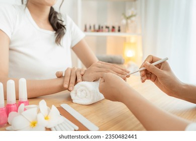 Woman receive care service by professional Beautician Manicure at spa centre. Nail beauty salon use nail file for Glazing treatment. manicurist make nail customer to beautiful. body care spa treatment - Powered by Shutterstock