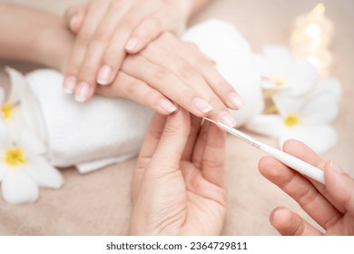 Woman receive care service by professional Beautician Manicure at spa centre. Nail beauty salon use nail file for Glazing treatment. manicurist make nail customer to beautiful. body care spa treatment - Shutterstock ID 2364729811