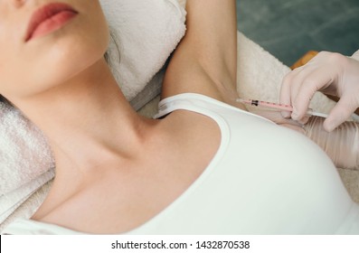 Woman Receives An Underarm Treatment, Hyperhidrosis. Armpit Injections To Prevent Excessive Sweating