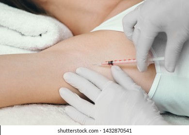 Woman Receives An Underarm Treatment, Hyperhidrosis. Armpit Injections To Prevent Excessive Sweating