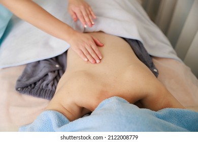 A Woman Receiving A Back Massage At An Esthetic Salon