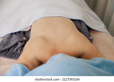 A Woman Receiving A Back Massage At An Esthetic Salon