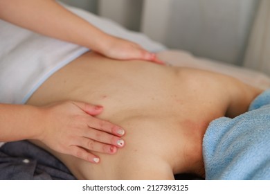 A Woman Receiving A Back Massage At An Esthetic Salon