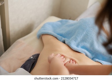 A Woman Receiving A Back Massage At An Esthetic Salon