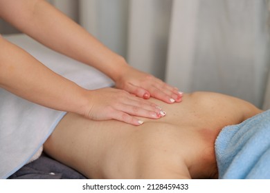 A Woman Receiving A Back Massage At An Esthetic Salon