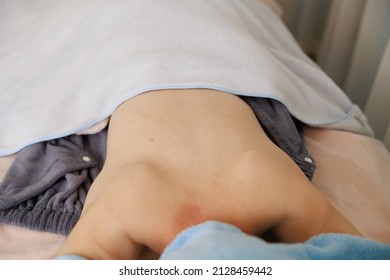 A Woman Receiving A Back Massage At An Esthetic Salon