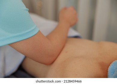 A Woman Receiving A Back Massage At An Esthetic Salon