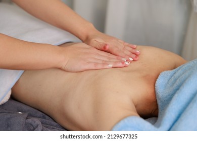 A Woman Receiving A Back Massage At An Esthetic Salon