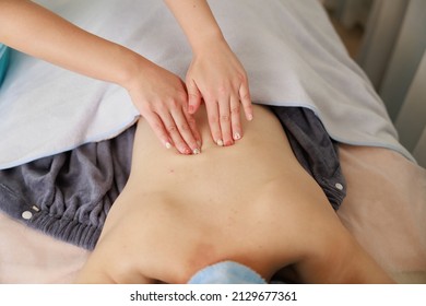 A Woman Receiving A Back Massage At An Esthetic Salon