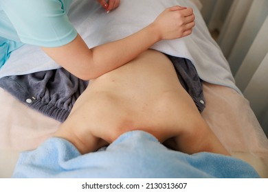 A Woman Receiving A Back Massage At An Esthetic Salon