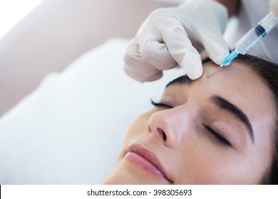 Woman Receiving Botox Injection At Spa